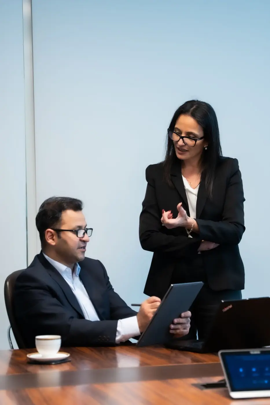 Bouchra Danwra advising an executive in a boardroom